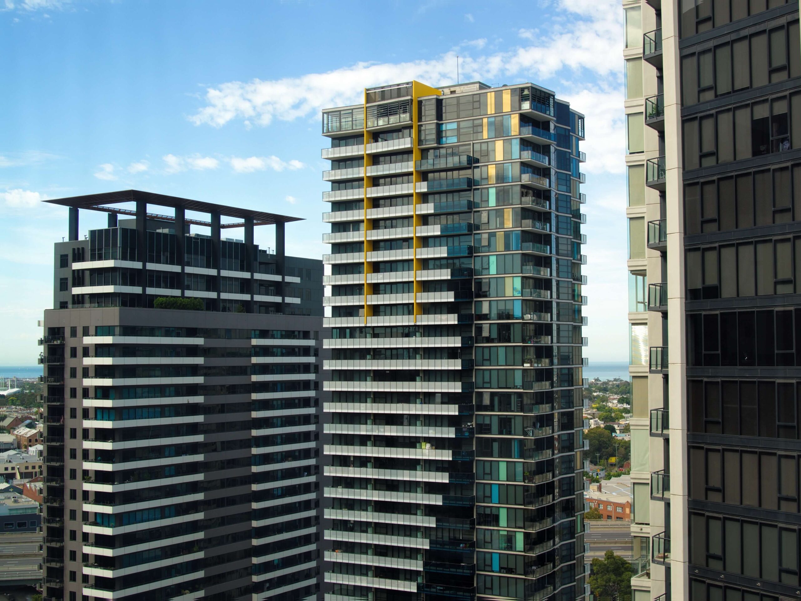 Two high rise multi-family buildings in a city. These buildings are part of the answer to the Australian housing crisis