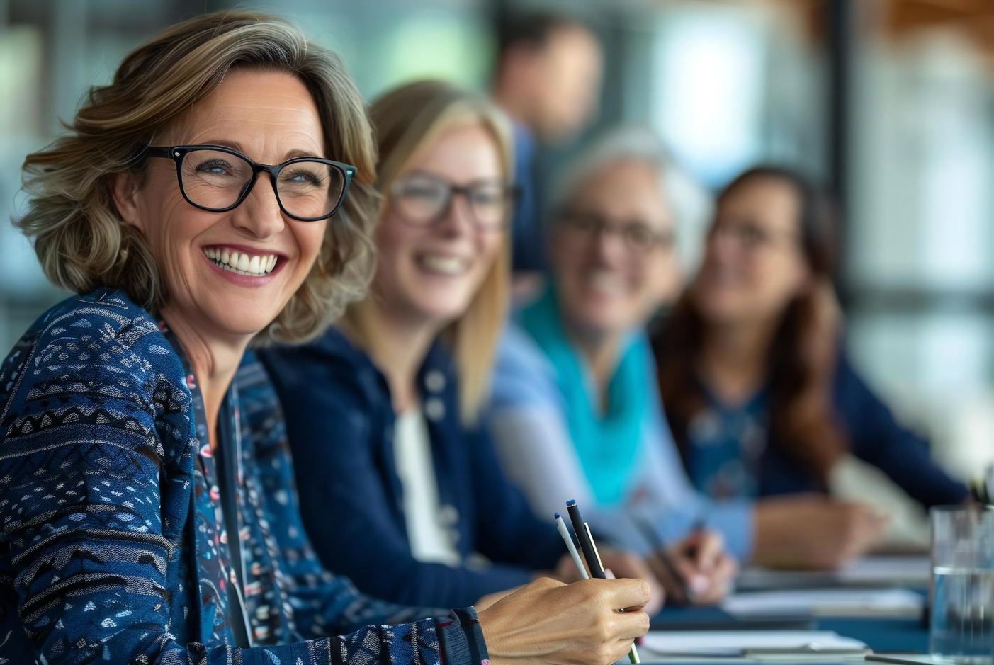 Woman on an owners' committee smiling about the roles and responsibilities of her position